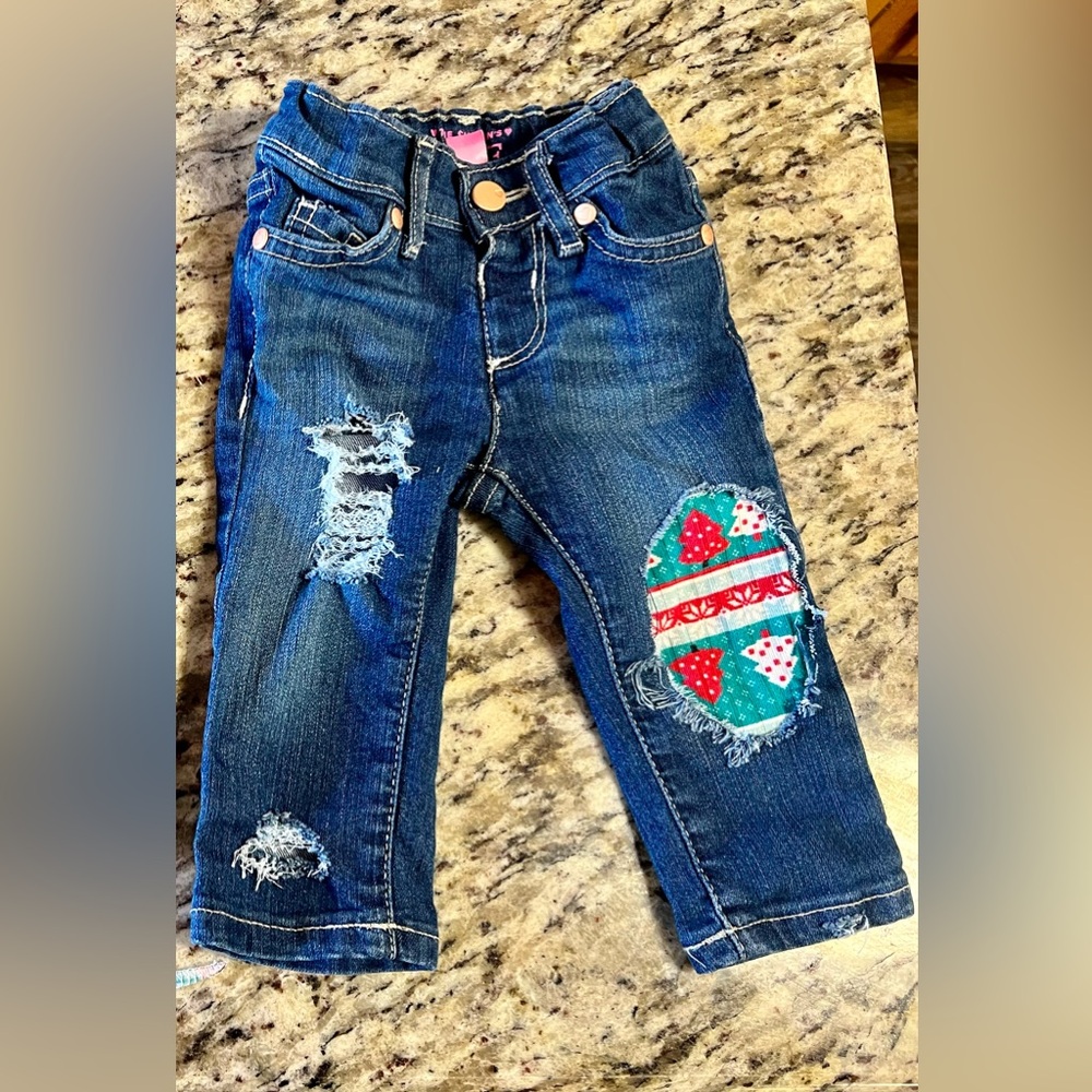 Distressed baby jeans